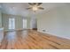 Large living room with hardwood floors and ceiling fan at 1060 River Cove Rd, Social Circle, GA 30025