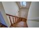 Elegant wooden staircase leading to the upper level at 1060 River Cove Rd, Social Circle, GA 30025