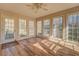 Sunroom with multiple windows and hardwood floors at 1060 River Cove Rd, Social Circle, GA 30025