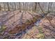 Wooded area with a small creek at 1060 River Cove Rd, Social Circle, GA 30025