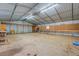 Large workshop with workbenches and overhead storage at 1060 River Cove Rd, Social Circle, GA 30025