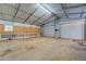 Spacious workshop with roll-up doors and workbenches at 1060 River Cove Rd, Social Circle, GA 30025