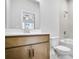 Bathroom with tub, toilet and wooden vanity at 1923 Rogers Ct, Atlanta, GA 30318