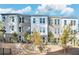 Modern townhome community with gray brick and white accents at 1923 Rogers Ct, Atlanta, GA 30318