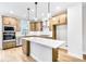 Modern kitchen with light wood cabinets and quartz countertops at 1923 Rogers Ct, Atlanta, GA 30318