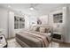 Spacious bedroom with hardwood floors and a neutral color scheme at 241 Thompson St, Alpharetta, GA 30009