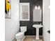 Modern powder room with dark marble tile and pedestal sink at 241 Thompson St, Alpharetta, GA 30009