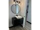 Modern bathroom with floating vanity and round mirror at 4756 Manly Ct, Stone Mountain, GA 30088