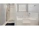 Bathroom with shower and a large, luxurious jetted tub at 250 Windsor Way, Fairburn, GA 30213