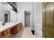 Clean bathroom with double sinks, a large mirror, and access to other rooms at 250 Windsor Way, Fairburn, GA 30213