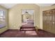 Spacious bedroom with high ceilings and a view into another room at 250 Windsor Way, Fairburn, GA 30213