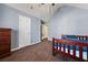 Simple bedroom with a single bed and closet, access to another room at 250 Windsor Way, Fairburn, GA 30213