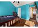 Spacious bedroom with wood floors and access to a hallway at 250 Windsor Way, Fairburn, GA 30213