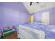 Well-lit bedroom with wood floors and a white sleigh bed at 250 Windsor Way, Fairburn, GA 30213