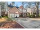 Brick two-story house with a two-car garage and a basketball hoop at 250 Windsor Way, Fairburn, GA 30213