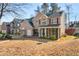 Two-story house with a covered porch and landscaping at 250 Windsor Way, Fairburn, GA 30213