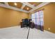 Home office with tile floors, built-in desk, and large window at 250 Windsor Way, Fairburn, GA 30213