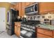 Stainless steel appliances and granite countertops in this bright kitchen at 250 Windsor Way, Fairburn, GA 30213