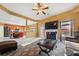 Spacious living room with fireplace, large TV and access to kitchen at 250 Windsor Way, Fairburn, GA 30213