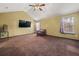 Large main bedroom with vaulted ceilings and a ceiling fan at 250 Windsor Way, Fairburn, GA 30213