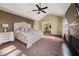 Bright main bedroom with high ceilings, fireplace and access to additional rooms at 250 Windsor Way, Fairburn, GA 30213