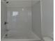 Bathroom with shower/tub combo and white tile at 3957 Knox Park Ovlk, Duluth, GA 30097