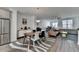 Open concept dining area with a wood table and stylish rug at 3957 Knox Park Ovlk, Duluth, GA 30097