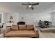 Spacious living room with hardwood floors, sectional sofa, and home office area at 3957 Knox Park Ovlk, Duluth, GA 30097