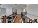 Upstairs hallway with hardwood floors and iron railings at 4325 Harrison Lndg, Cumming, GA 30041