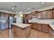 Modern kitchen with granite countertops, stainless steel appliances, and an island at 4325 Harrison Lndg, Cumming, GA 30041