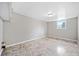 Finished basement room with neutral walls and flooring at 566 Camp Perrin Rd, Lawrenceville, GA 30043