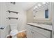 Updated bathroom with granite vanity and stylish mirror at 566 Camp Perrin Rd, Lawrenceville, GA 30043