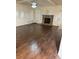 Living room featuring hardwood floors and a stone fireplace at 7940 White Oak Loop, Lithonia, GA 30038