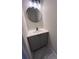 Updated bathroom with a modern vanity and a large mirror at 2759 Kerri Pl, Lithia Springs, GA 30122