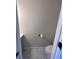 Small, simple bathroom with white toilet and marble-look flooring at 2759 Kerri Pl, Lithia Springs, GA 30122