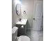 Bathroom with gray vanity, toilet, and marble-look floors at 2759 Kerri Pl, Lithia Springs, GA 30122