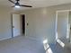 Bright bedroom with ceiling fan and access to closets at 2759 Kerri Pl, Lithia Springs, GA 30122