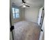 Spacious bedroom with neutral walls, ceiling fan, and neutral carpet at 2759 Kerri Pl, Lithia Springs, GA 30122