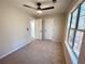 Bright bedroom with large windows, ceiling fan, and neutral decor at 2759 Kerri Pl, Lithia Springs, GA 30122