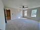 Spacious bedroom with two windows and ceiling fan at 2759 Kerri Pl, Lithia Springs, GA 30122