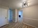 Bright dining room with hardwood floors and modern light fixture at 2759 Kerri Pl, Lithia Springs, GA 30122