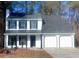 Two-story house with white siding, black shutters, and a two-car garage at 2759 Kerri Pl, Lithia Springs, GA 30122