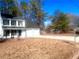 Front view of a renovated two-story house with a large yard at 2759 Kerri Pl, Lithia Springs, GA 30122