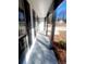 Covered front porch with gray concrete flooring and dark gray support beams at 2759 Kerri Pl, Lithia Springs, GA 30122