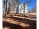 Side view of a two story house with a wooded backdrop at 2759 Kerri Pl, Lithia Springs, GA 30122