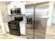 Modern kitchen boasts stainless steel appliances and granite countertops at 2759 Kerri Pl, Lithia Springs, GA 30122