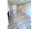 Spacious living room with wood-look floors and neutral walls at 2759 Kerri Pl, Lithia Springs, GA 30122