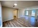 Spacious living room with wood-look floors, neutral walls, and fireplace at 2759 Kerri Pl, Lithia Springs, GA 30122
