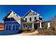 Two-story house with gray siding, two-car garage, and a covered porch at 208 Serendipity Way, Dallas, GA 30157