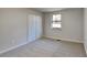 Spacious bedroom with double door closet and window at 3743 Junior Ln, Douglasville, GA 30135